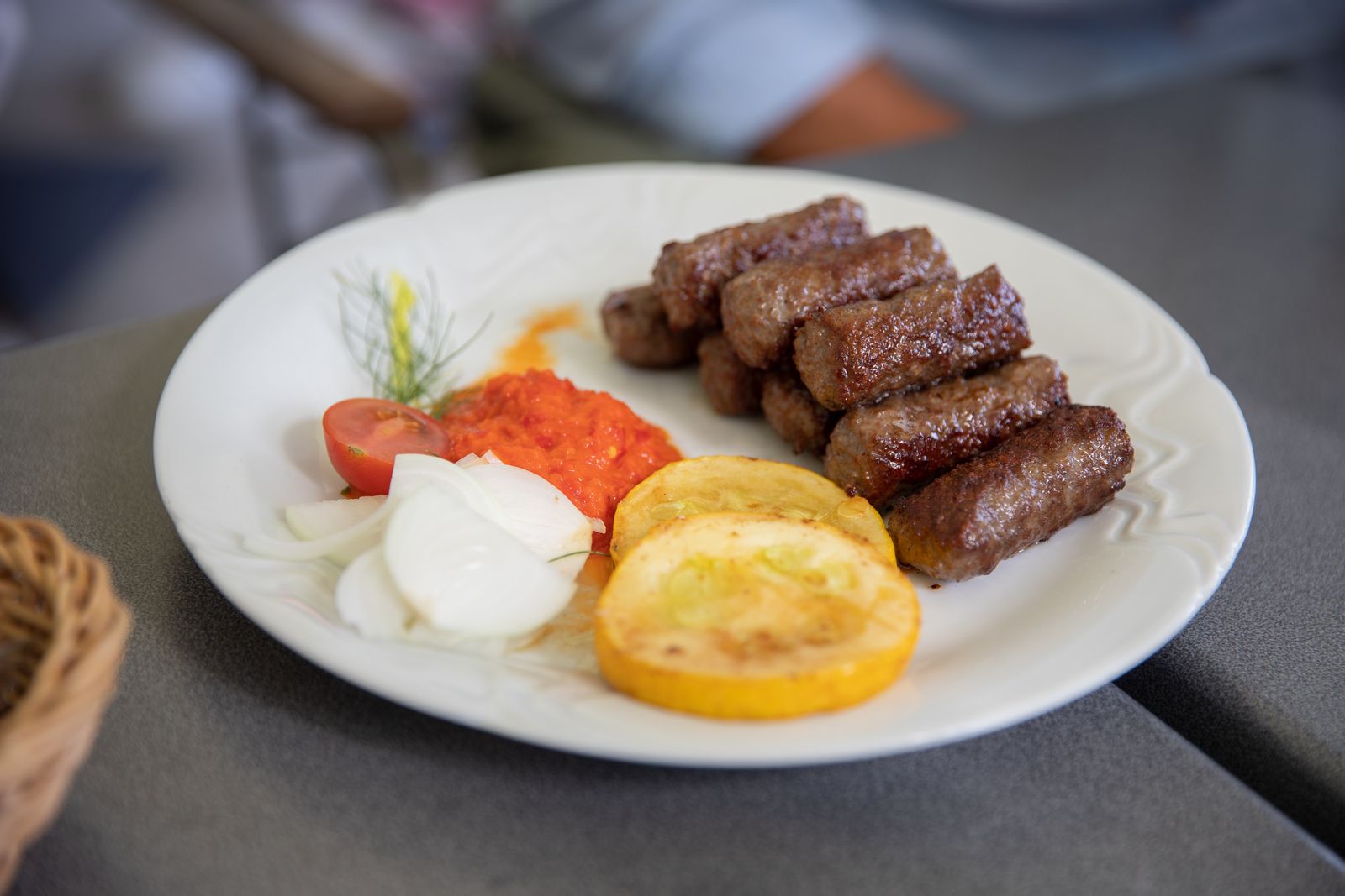 Ćevapi with ajvar, onions and grilled vegetables