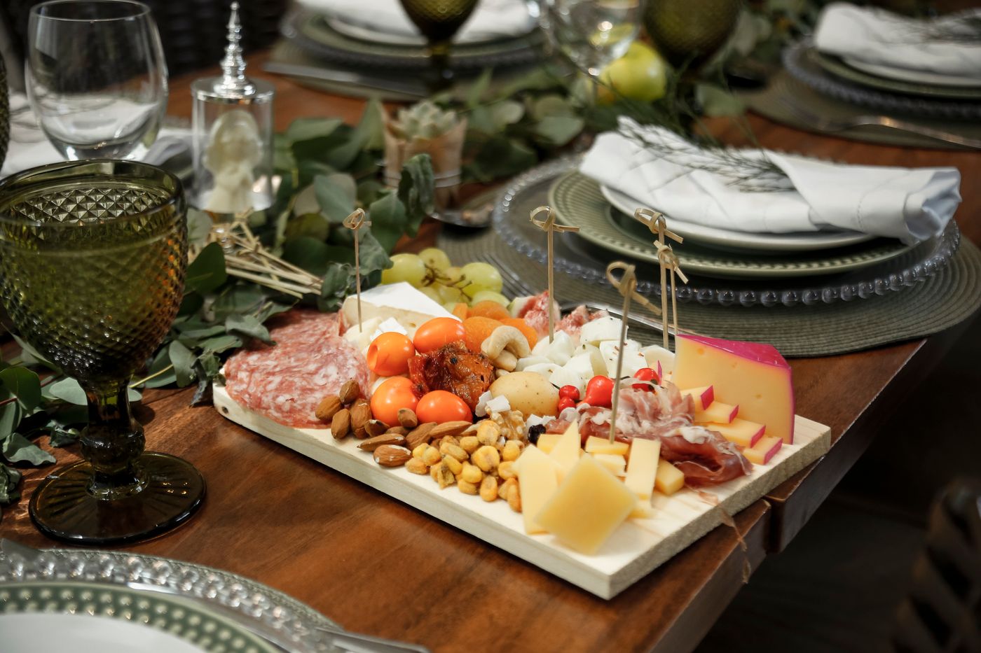 Charcuterie board set at a dining table
